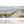 Laden Sie das Bild in den Galerie-Viewer, Acrylgemälde mit Sandstrand, Meer, Wellen, Dünen und Gras. Im Hintergrund fliegen ein paar Möwen auf dem Acryl Gemälde