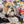 Laden Sie das Bild in den Galerie-Viewer, Auf dem Acrylgemälde old english Bulldog trägt der Hund eine Brille und ließt dabei eine Zeitung. Der Hintergrund ist im Graffity Style.