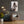 Laden Sie das Bild in den Galerie-Viewer, Eine Musikerin mit E-Gitarre steht auf der Bühne und performt. Das sieht man auf dem Acrylgemälde welches an einer dunklen Wand in einem Proberaum hängt.
