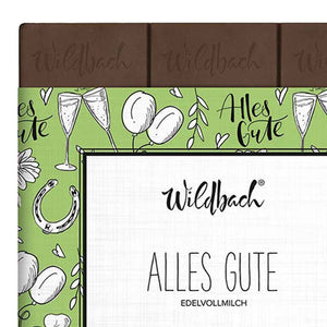 Schokolade Wildbach Vollmilch 38%. Auf der grünen Verpackung steht Alles Gute, Edelvollmilch