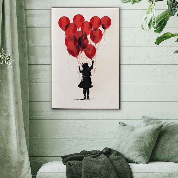 An einer grünen Wand hängt ein Acrylgemälde. Auf dem Bild ist ein Mädchen mit roten Luftballons zu sehen. Das Gemälde symbolisiert "loslassen"