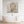 Laden Sie das Bild in den Galerie-Viewer, Das Gemälde zeigt einen Buddhakopf. Das Gemälde hängt über einer Badewanne.
