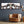 Modernes Panorama-Wandbild mit fünf glücklichen Kühen, Sonnenbrillen und Perücken in einem Wohnzimmer – humorvolle Kunst und Deko.