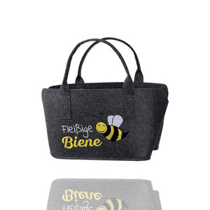 Tasche aus Filz mit einer Biene und dem Schriftzug Fleißige Biene eingestickt.