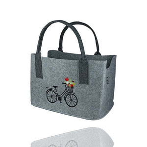 Filztasche mit schwarzem Fahrrad und einem bunten Blumenkorb. Lange Henkel zum leichten Schultern der Tasche.