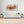 Laden Sie das Bild in den Galerie-Viewer, An einer weißen Wand über dem Sideboard hängt ein modernes abstraktes Acrylgemälde mit dem namen &quot;Irisierende Spiegelung.
