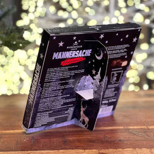 Der Niederegger Männersache Mini Adventskalender kommt mit einem Pappfuß um ihn auf dem Tisch platzieren zu können.