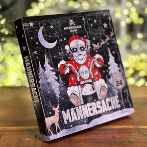 Niederegger Lübeck steht auf dem Männersache Mini-Adventskalender. Ein Bikder im Nikolauskostüm fährt ein Motorrad.