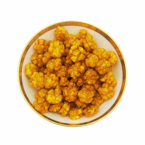 Goldgelbe frietierte Reis Currycracker von Jalalldor. Der knackige Knabberspass mt Crunch.