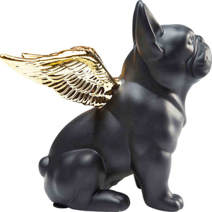 Eine kleine Hundefigur mit goldenen Flügeln auf dem Rücken