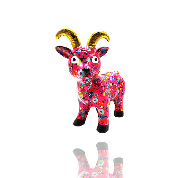 Was für eine wunderschöne Pinke Geschenidee. Die Ziege Gabriel ist eine pinkfarbene Spardose der Marke Pomme Pidou mit goldenen Hörnern.