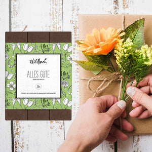 Wildbach Alles Gute Vollmilch Schokolade in einer schönen grünen Verpackung mit Luftballons