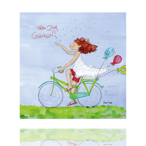 Ein Fahrrad an dem Luftballons befestigt sind und eine lächelnde Dame. Der Spruch "Freu Dich glücklich" passt hervorragend zu dem Holzbild der Künstlerin Karin Tauer.